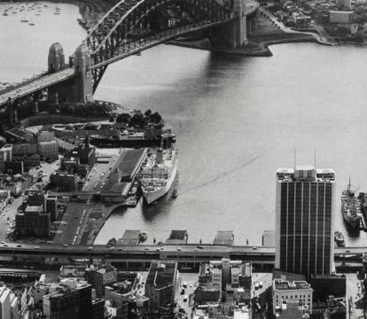 A view of city skyline and Sydney opera house under construction.
