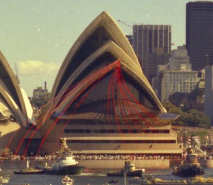 The grand opening of the Sydney opera house with boats around the harbor.