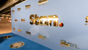 A premier backdrop with golden 'Stan.'
