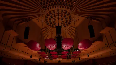 An Orchestra on the Concert Hall stage.