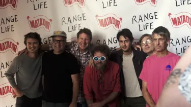 The band Pavements stand with Joe and Nat at a film premiere.