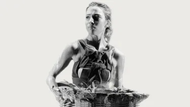 A young woman holding a basket.