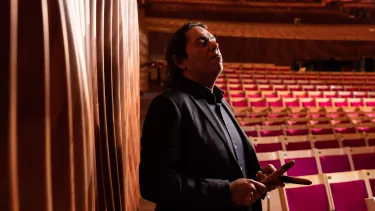 Australian multi-instrumentalist William Barton stands in the Opera House Concert Hall.