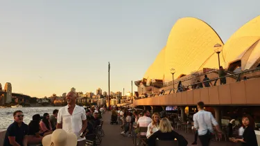 The House Canteen next to the sails as the sun sets.