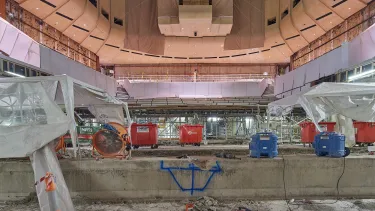 The old stage is getting cleared of any concrete debris.