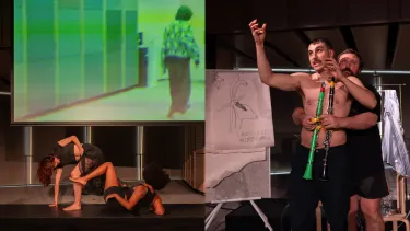 Four performers on a stage mid-performance.